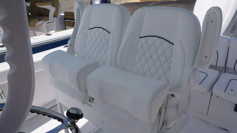 Slide: The Image of 2023 Sportsman 231 Heritage boat with luxurious white leather seats. - 17