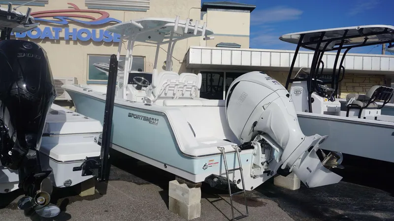 Slide: The Image of 2023 Sportsman 231 Heritage boat displayed at dealership with Yamaha outboard motor. - 20