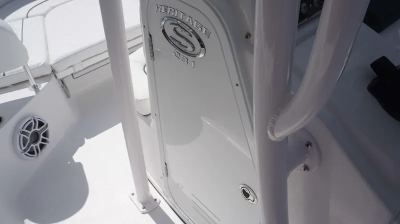 Slide: The Image of 2023 Sportsman 231 Heritage boat interior detail with logo and seating. - 6