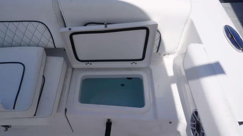 Slide: The Image of 2023 Sportsman 231 Heritage boat with open storage compartment. - 8