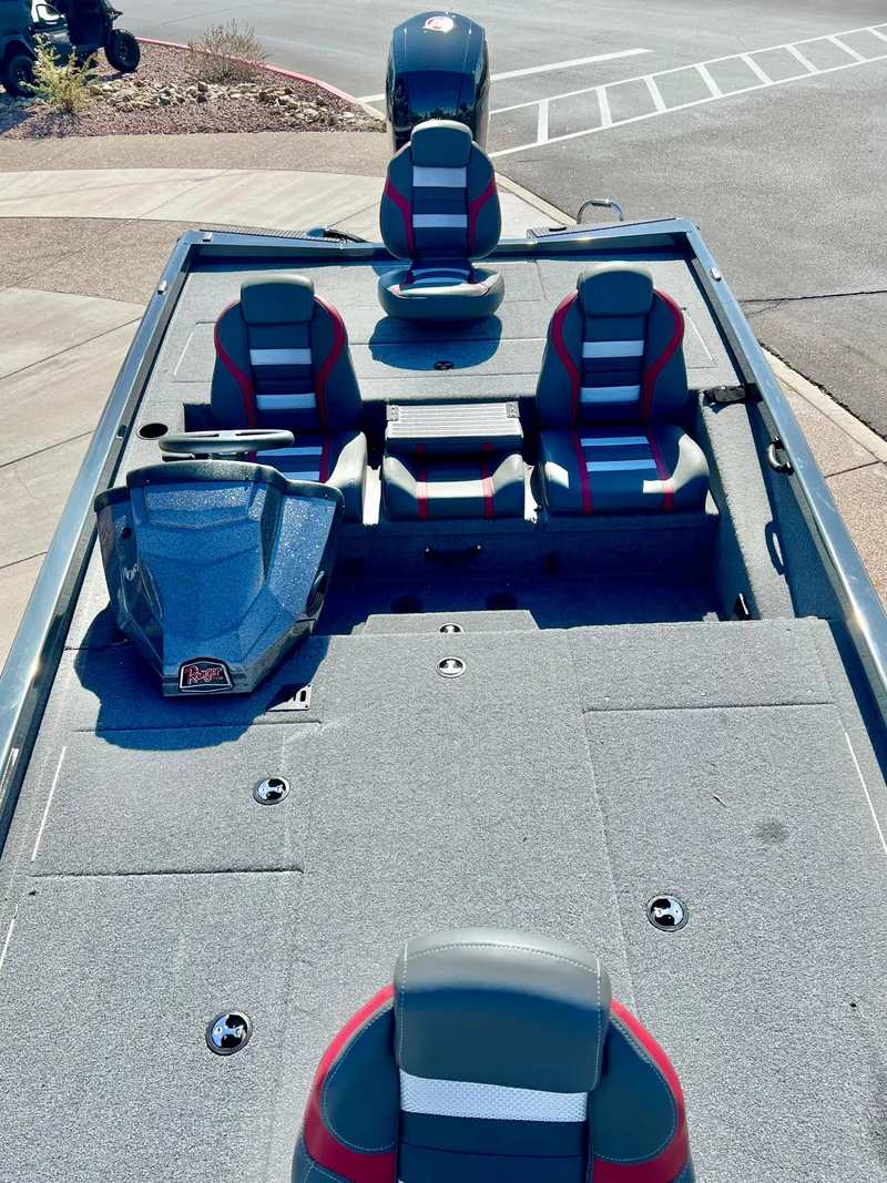 Slide: The Image of 2023 Ranger RT198P fishing boat with seating and console. - 2