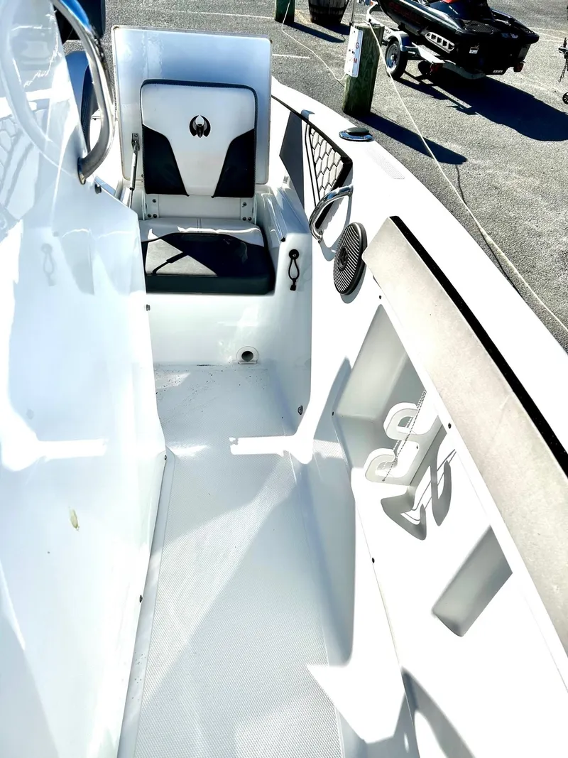 Slide: The Image of 2020 Scarab 195 Open ID boat interior with seating and storage features. - 13