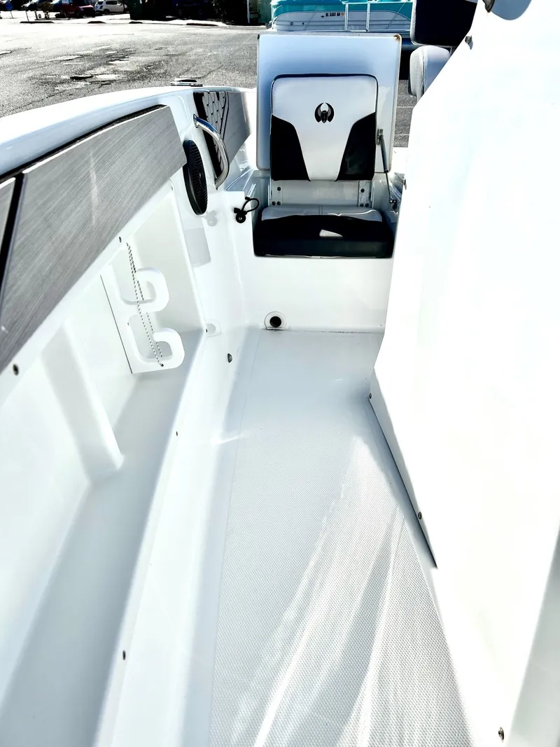 Slide: The Image of 2020 Scarab 195 Open ID boat interior, featuring sleek white seating and modern design. - 14