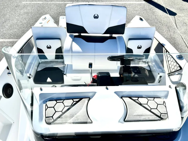 Slide: The Image of 2020 Scarab 195 Open ID boat interior with modern seating and steering console. - 15