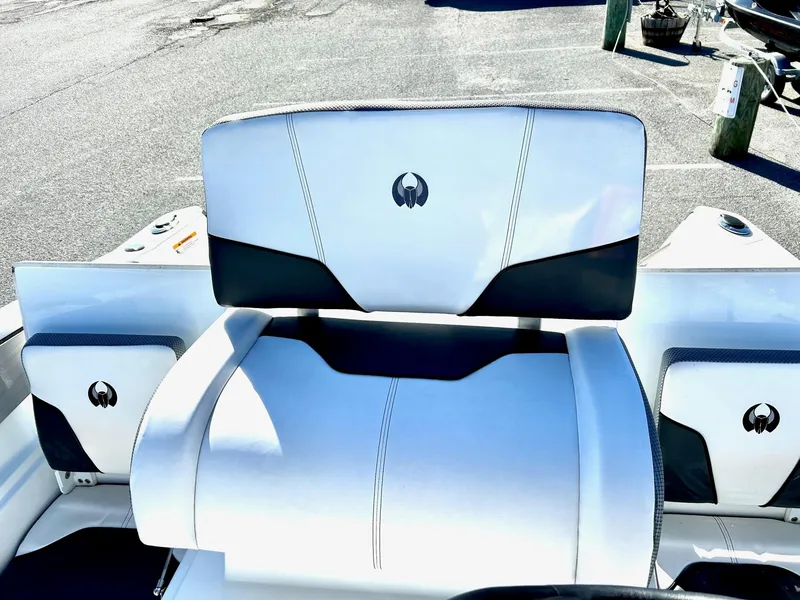 Slide: The Image of 2020 Scarab 195 Open ID boat interior with white and black seating. - 17