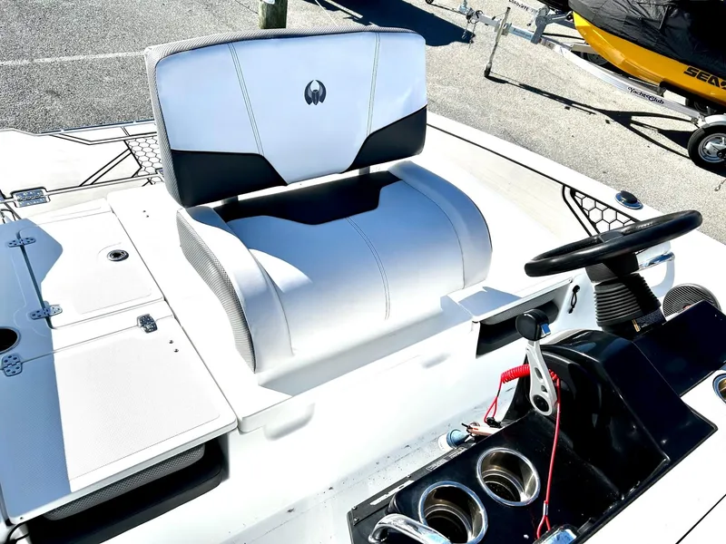 Slide: The Image of 2020 Scarab 195 Open ID boat interior with steering wheel and seating. - 19