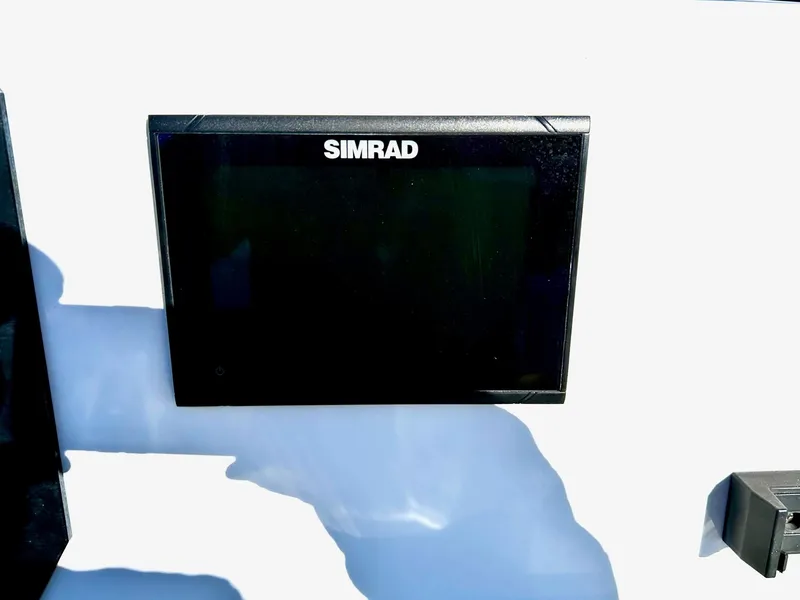Slide: The Image of Simrad display on 2020 Scarab 195 Open ID boat dashboard. - 21