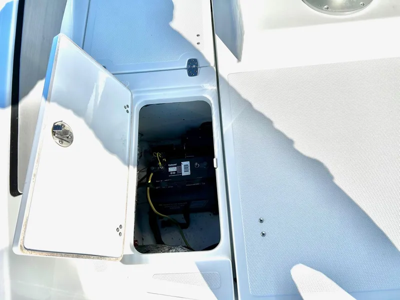 Slide: The Image of 2020 Scarab 195 Open ID boat battery compartment with open hatch. - 27