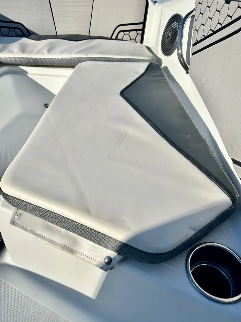 Slide: The Image of 2020 Scarab 195 Open ID boat interior with cushioned seating and cup holder. - 31