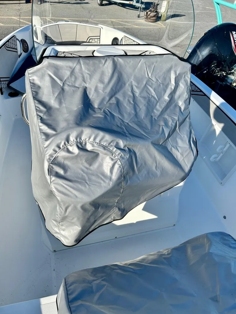 Slide: The Image of 2020 Scarab 195 Open ID boat interior with covered seats. - 34