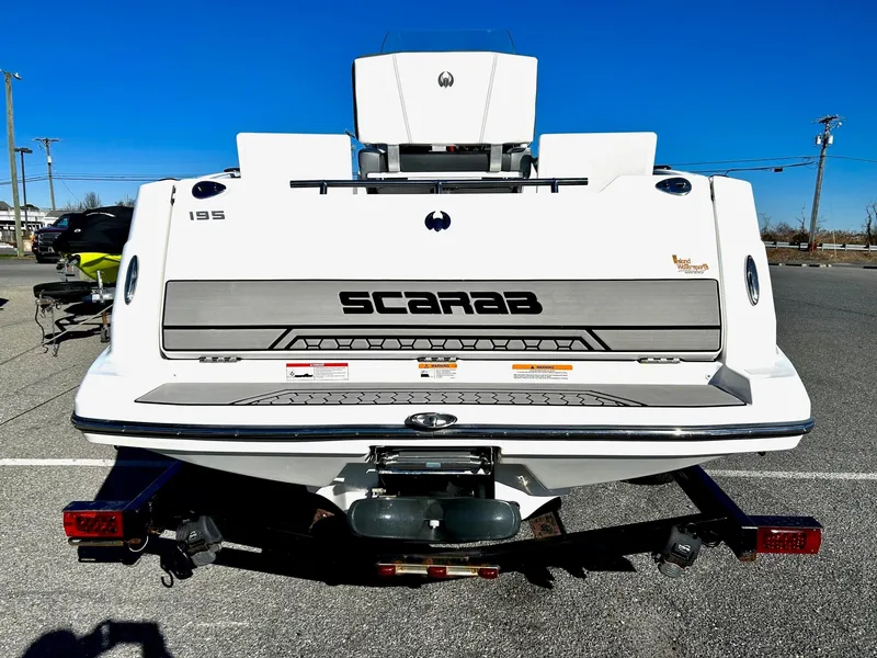 Slide: The Image of 2020 Scarab 195 Open ID boat rear view on trailer. - 38