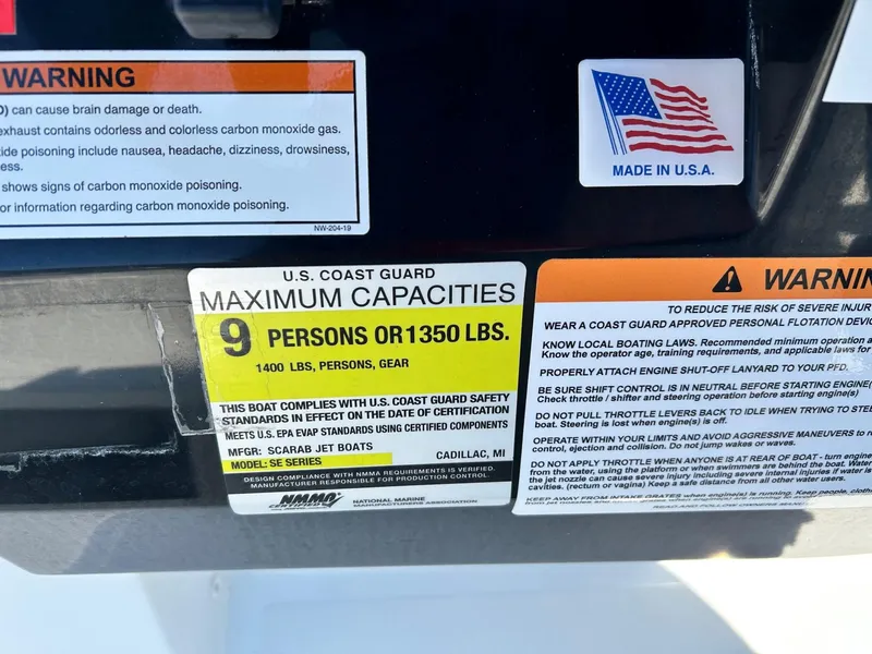 Slide: The Image of Scarab 195 Open ID 2020 boat capacity label, 9 persons or 1350 lbs, made in USA. - 41