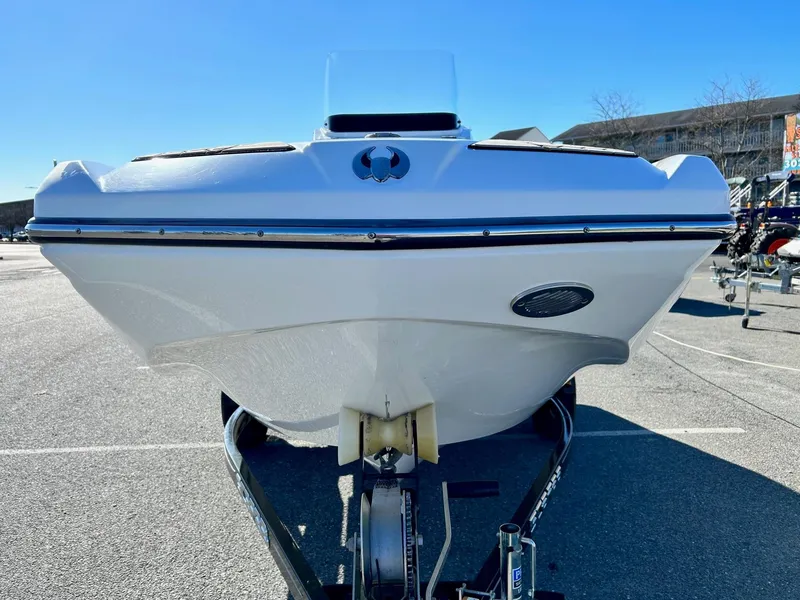 Slide: The Image of 2020 Scarab 195 Open ID boat on trailer, front view in parking lot. - 6