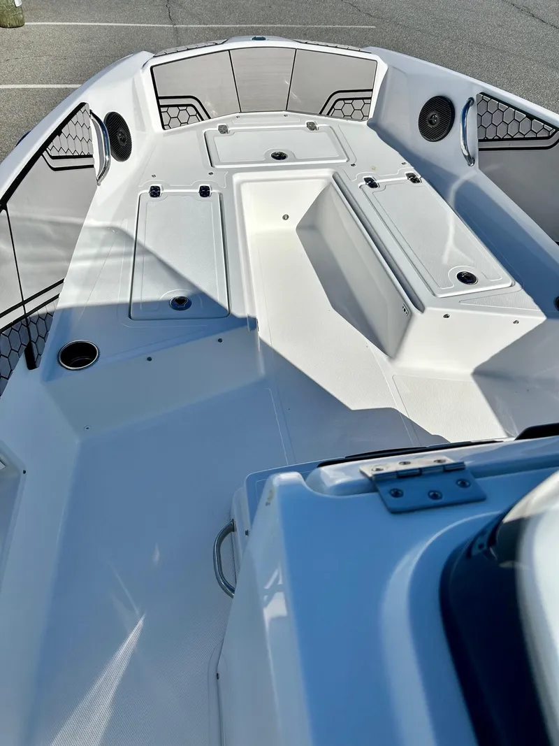 Slide: The Image of 2020 Scarab 195 Open ID boat interior with seating and storage compartments. - 7