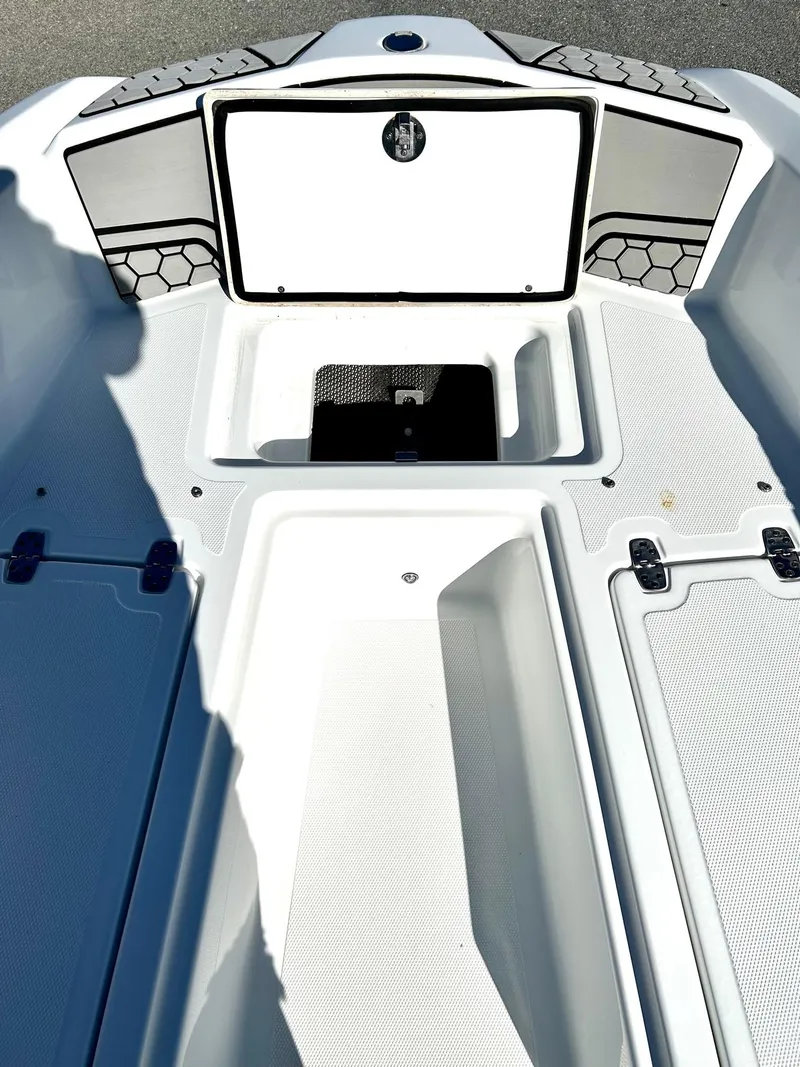 Slide: The Image of 2020 Scarab 195 Open ID boat interior with storage compartments and sleek design. - 9