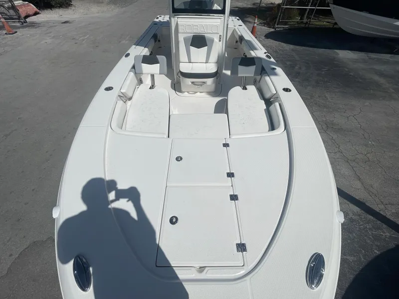 Slide: The Image of 2023 Robalo 246 Cayman boat, white deck, spacious seating, outdoor setting. - 10