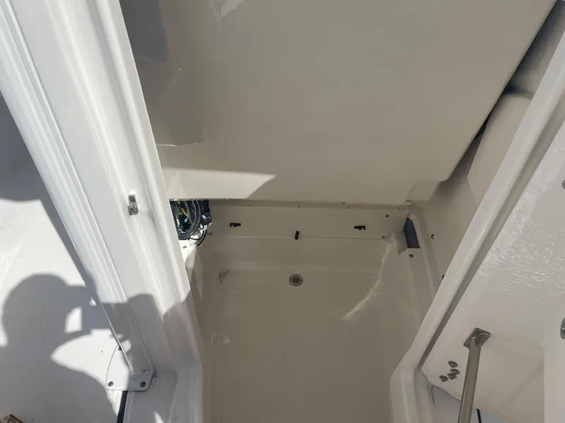 Slide: The Image of 2023 Robalo 246 Cayman boat interior storage compartment. - 14