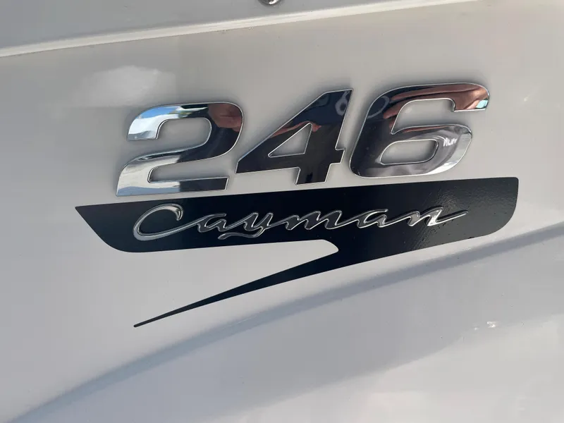 Slide: The Image of Robalo 246 Cayman 2023 model emblem on boat exterior. - 19