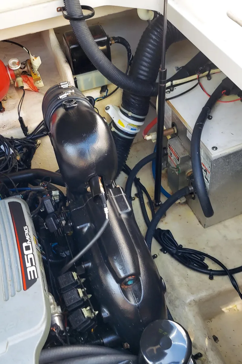 Slide: The Image of Engine compartment of a 2012 Sea Ray 240 Sundancer boat. - 24