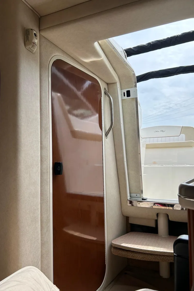 Slide: The Image of Interior cabin view of 2012 Sea Ray 240 Sundancer boat. - 30