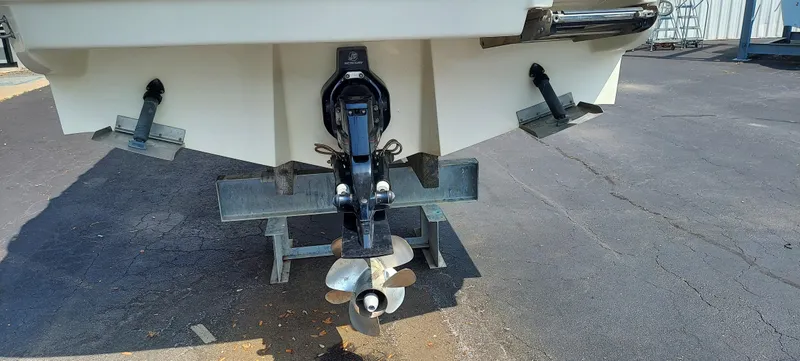 Slide: The Image of 2012 Sea Ray 240 Sundancer boat stern with propeller and trim tabs. - 4