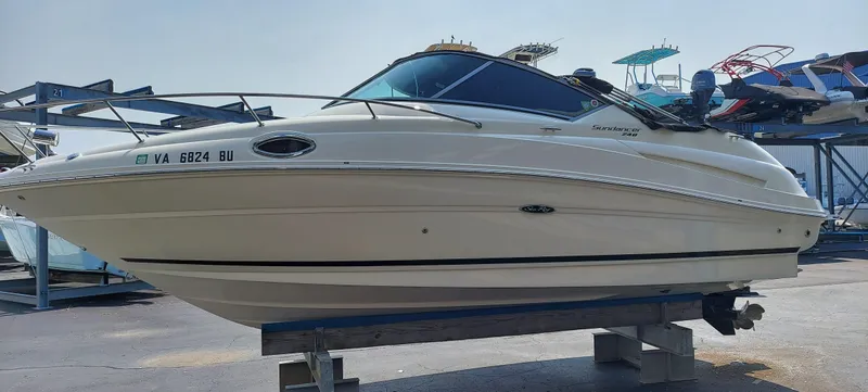 Slide: The Image of 2012 Sea Ray 240 Sundancer boat on a dry dock. - 5