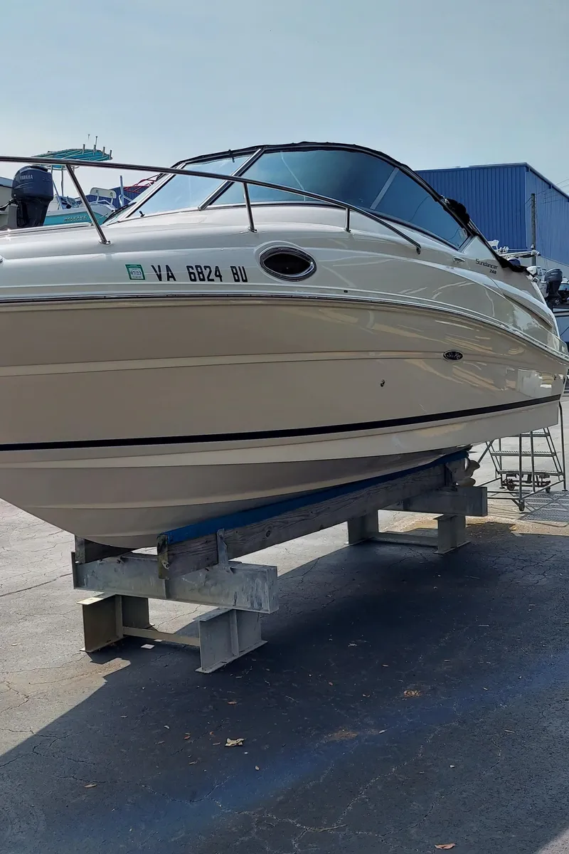 Slide: The Image of 2012 Sea Ray 240 Sundancer boat on dry dock. - 7