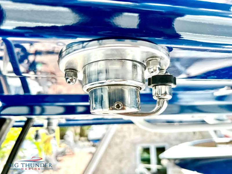 Slide: The Image of Close-up of a 2023 Fountain 38 CC boat's metallic fixture. - 12