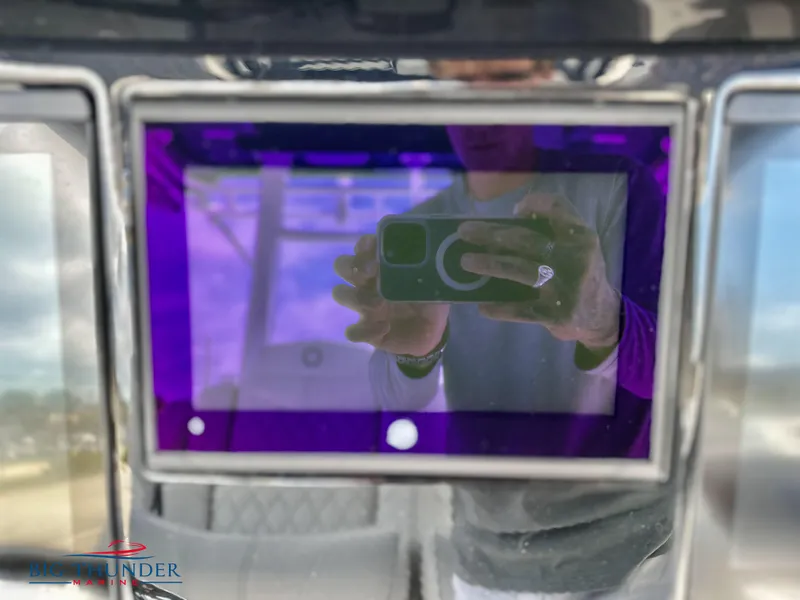 Slide: The Image of Close-up of the dashboard screen on a 2023 Fountain 38 CC boat. - 16