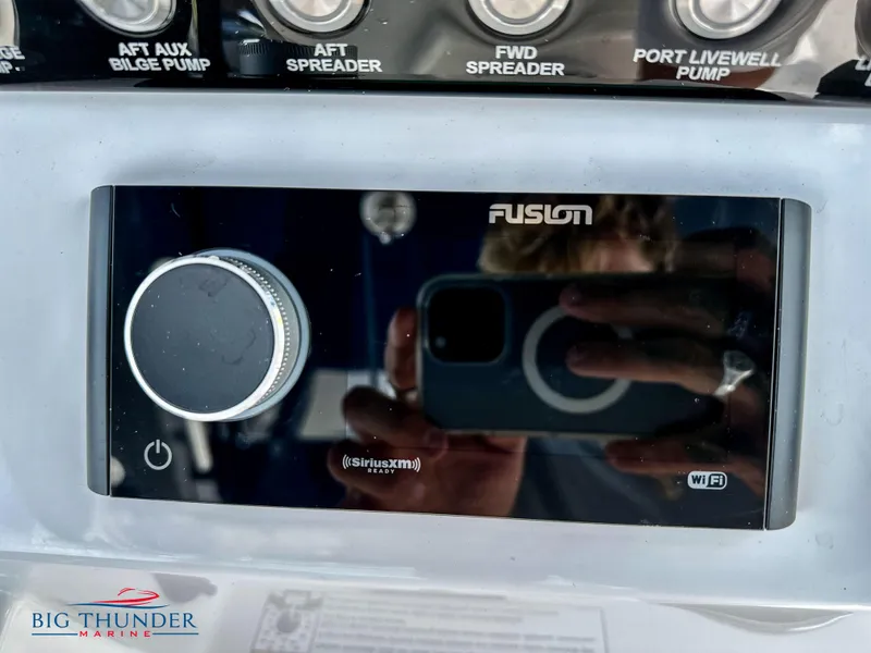 Slide: The Image of Fusion audio system on a 2023 Fountain 38 CC boat dashboard. - 20