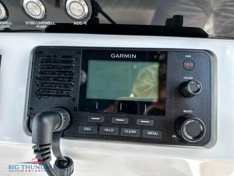 Slide: The Image of Garmin marine radio on 2023 Fountain 38 CC boat dashboard. - 21