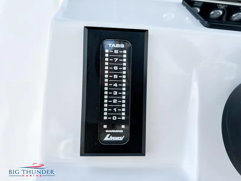 Slide: The Image of Trim tab indicator on 2023 Fountain 38 CC boat dashboard, Big Thunder Marine logo. - 23