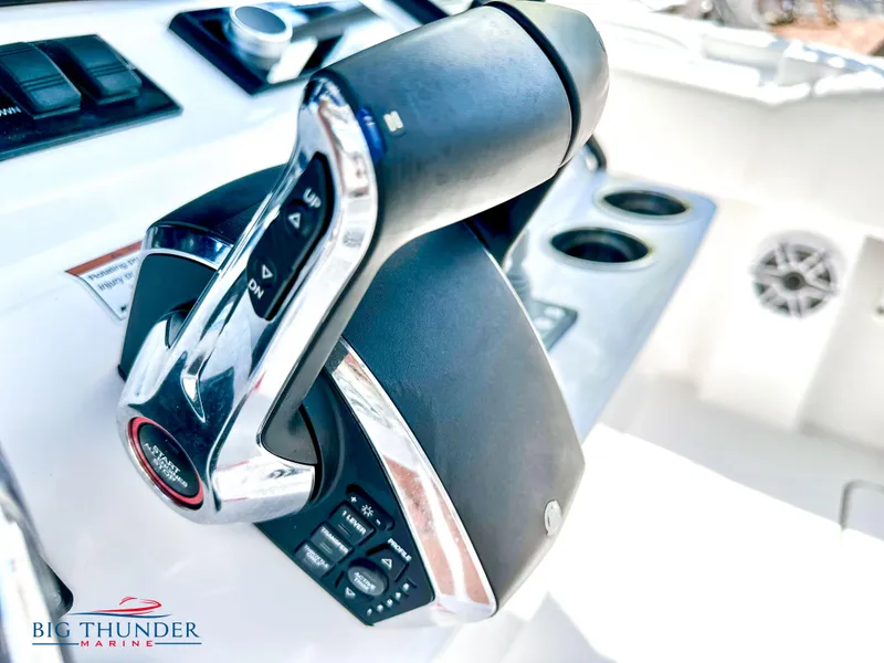 Slide: The Image of Close-up of the control lever on a 2023 Fountain 38 CC boat. - 25