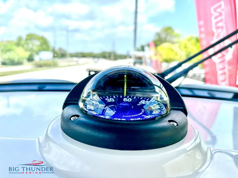 Slide: The Image of Compass on the dashboard of a 2023 Fountain 38 CC boat by Big Thunder Marine. - 26