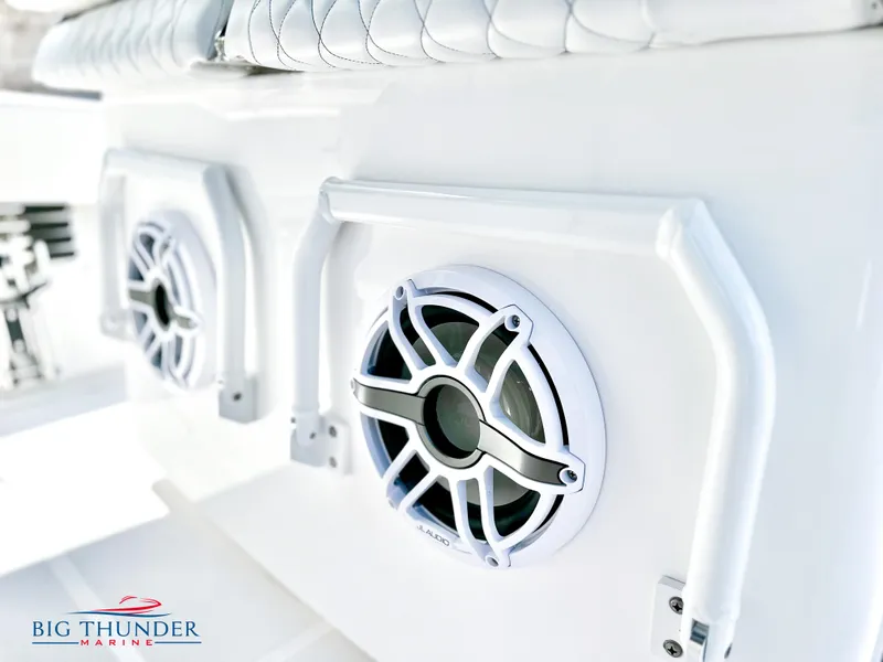 Slide: The Image of Close-up of 2023 Fountain 38 CC boat speakers and seating, Big Thunder Marine logo visible. - 27