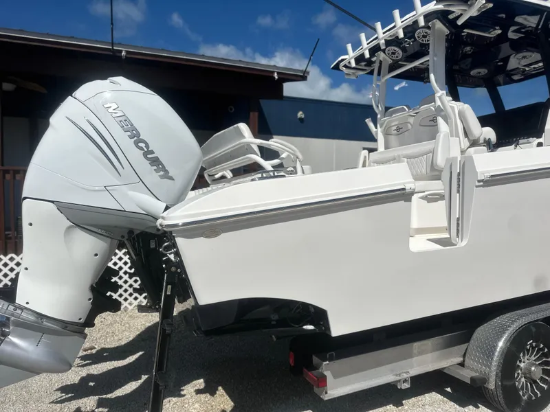 Slide: The Image of 2023 Fountain 38 CC boat with Mercury outboard engine on a trailer. - 3