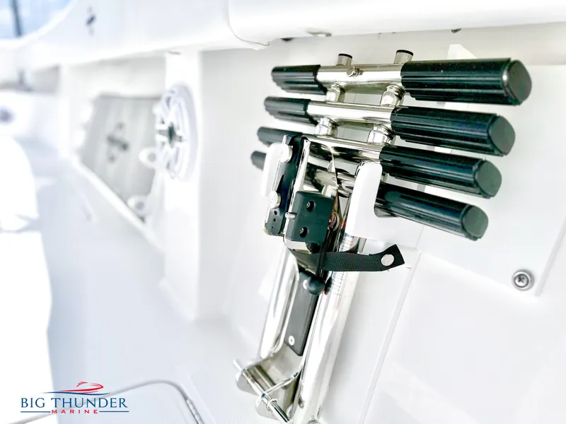 Slide: The Image of 2023 Fountain 38 CC boat rod holders and equipment on deck, Big Thunder Marine logo. - 30