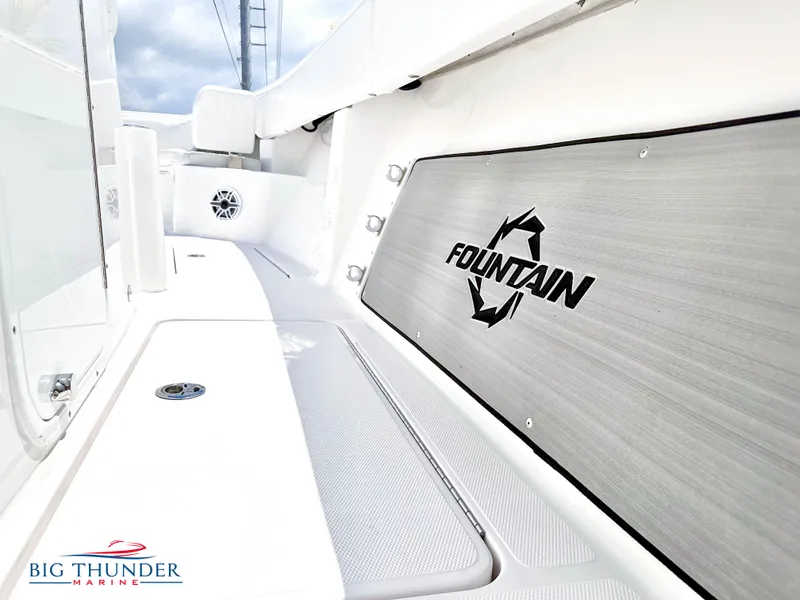 Slide: The Image of 2023 Fountain 38 CC boat interior with logo and Big Thunder Marine branding. - 33