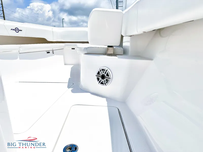 Slide: The Image of 2023 Fountain 38 CC boat interior with seating and speaker, Big Thunder Marine logo. - 34