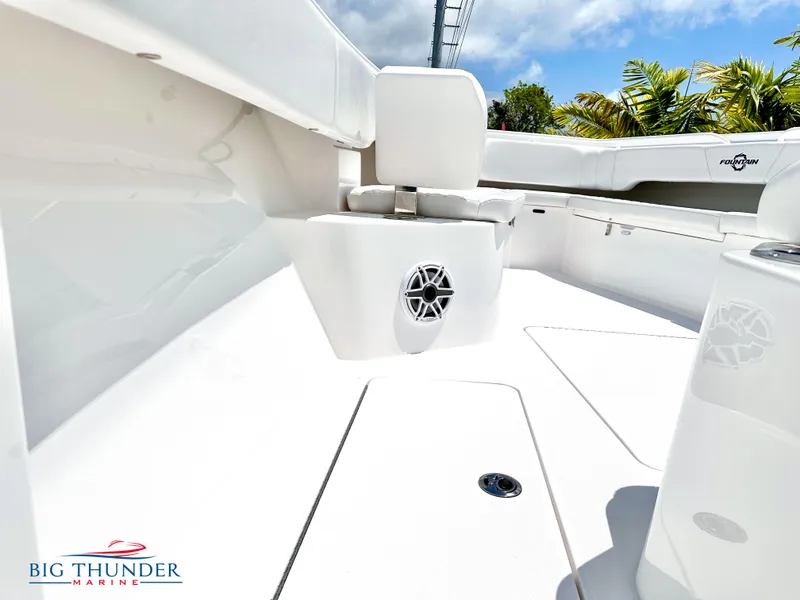 Slide: The Image of 2023 Fountain 38 CC boat interior with white seating and speaker, Big Thunder Marine. - 37