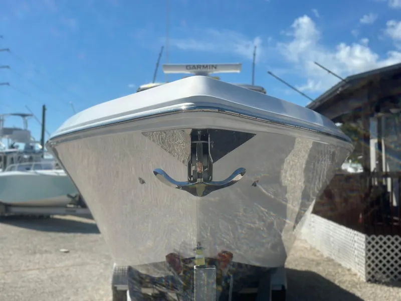 Slide: The Image of 2023 Fountain 38 CC boat front view under clear blue sky. - 4