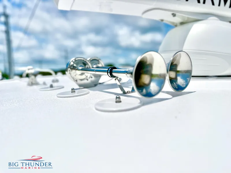 Slide: The Image of 2023 Fountain 38 CC boat detail with chrome horns, Big Thunder Marine logo. - 48
