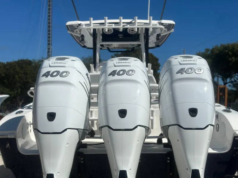 Slide: The Image of 2023 Fountain 38 CC boat with triple 400 horsepower engines, rear view. - 6