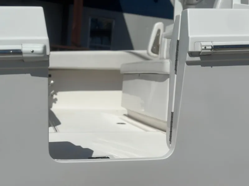 Slide: The Image of 2023 Fountain 38 CC boat interior, featuring sleek white seating and modern design. - 8