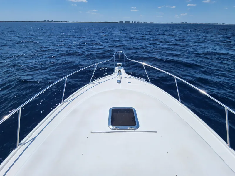 Slide: The Image of 2005 Tiara Yachts 3800 Open cruising on open water. - 13
