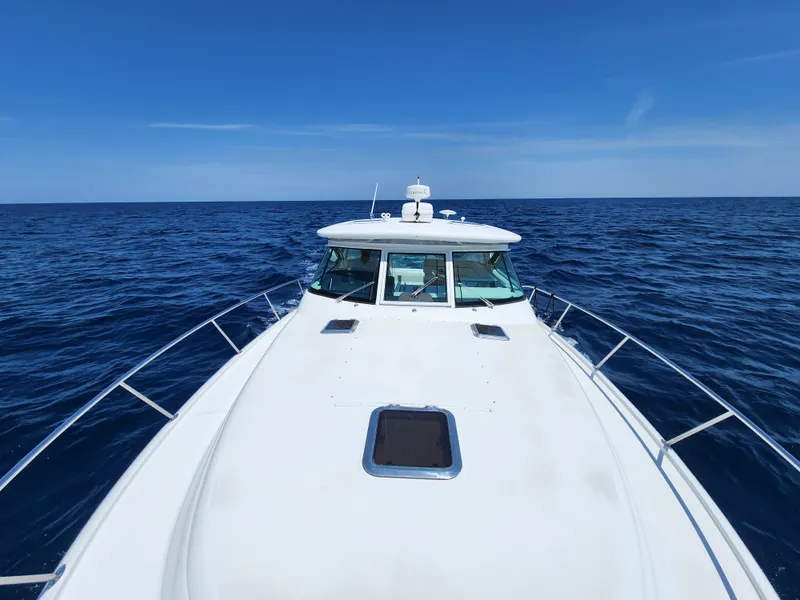 Slide: The Image of 2005 Tiara Yachts 3800 Open cruising on open blue sea. - 14