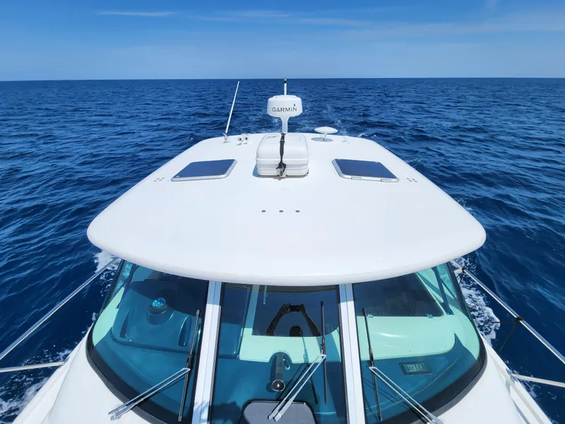 Slide: The Image of 2005 Tiara Yachts 3800 Open cruising on open blue sea. - 15