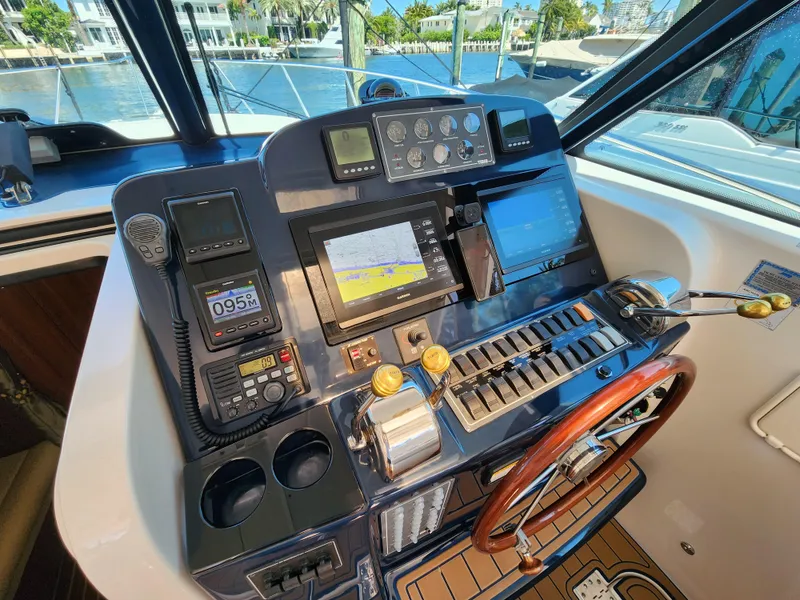 Slide: The Image of 2005 Tiara Yachts 3800 Open helm with navigation and control systems. - 20