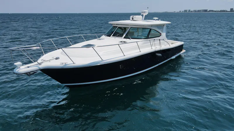 Slide: The Image of 2005 Tiara Yachts 3800 Open cruising on open water. - 3