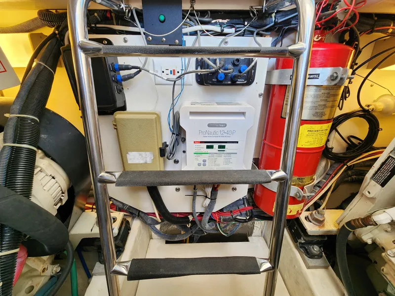Slide: The Image of Engine room of a 2005 Tiara Yachts 3800 Open with electrical panel and fire extinguisher. - 30